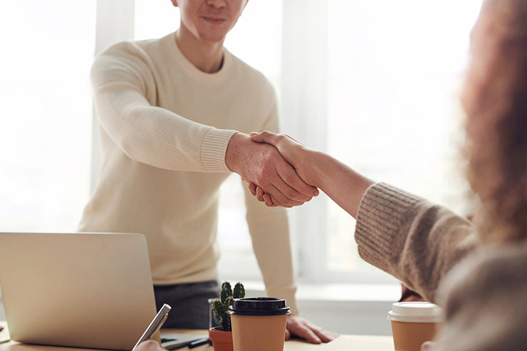 Shaking Hands At Business Meeting
