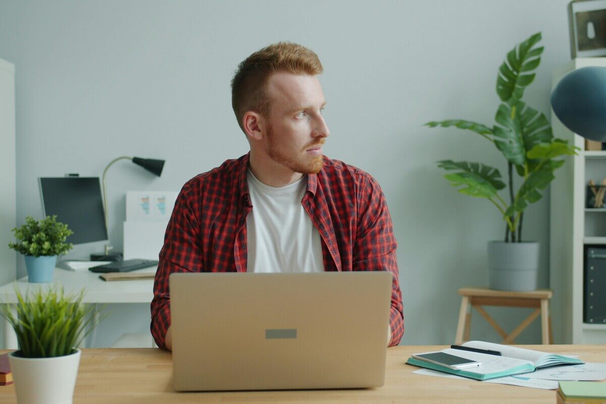 Young man learning more about information security qualifications