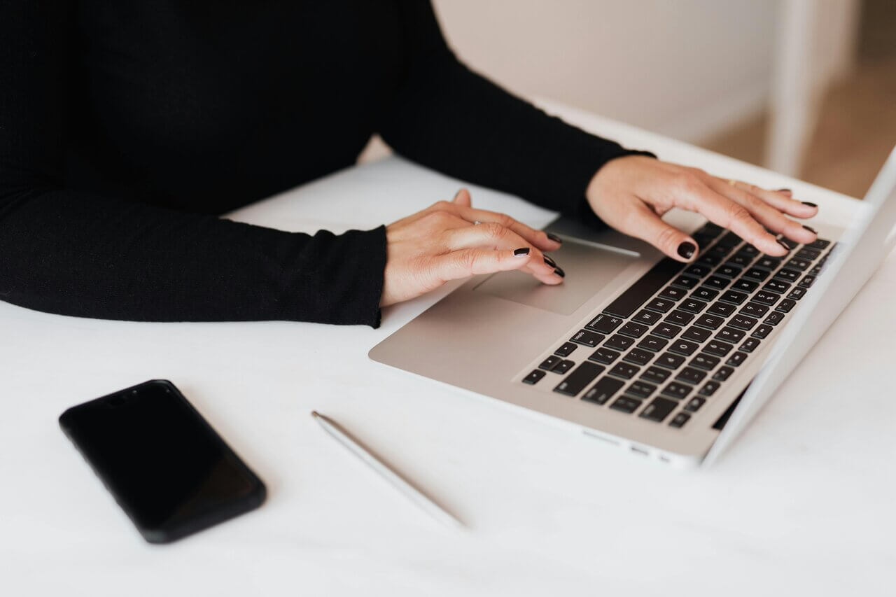 Woman learning more about AAT Level 4 assessments