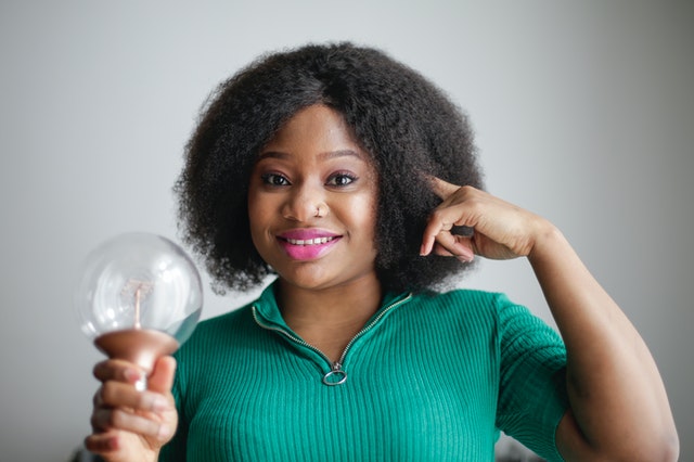 Woman Holding A Bulb Idea