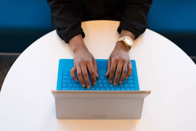 Hands Typing Laptop