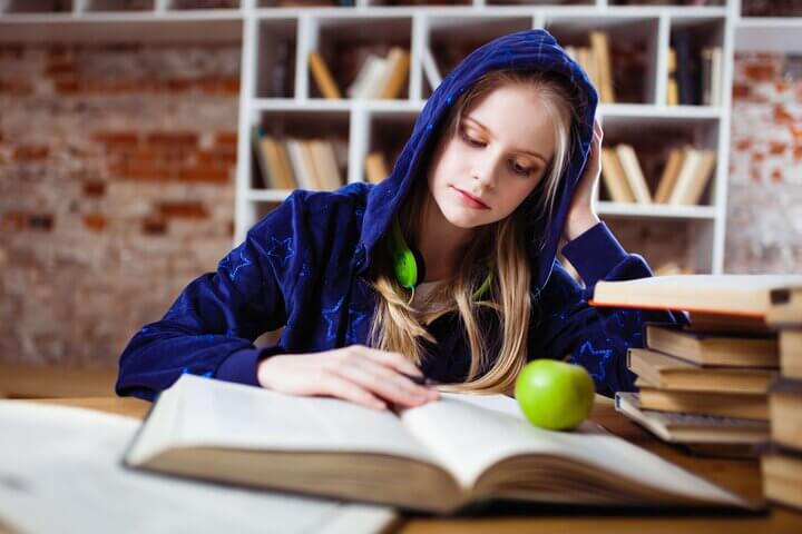 girl studying with apple